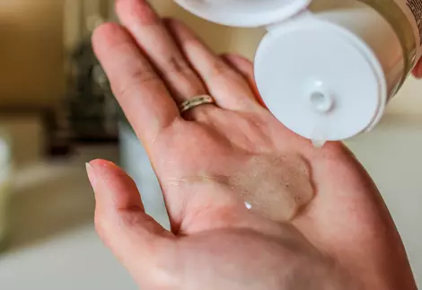 Cosmetic product squeezed onto the palm