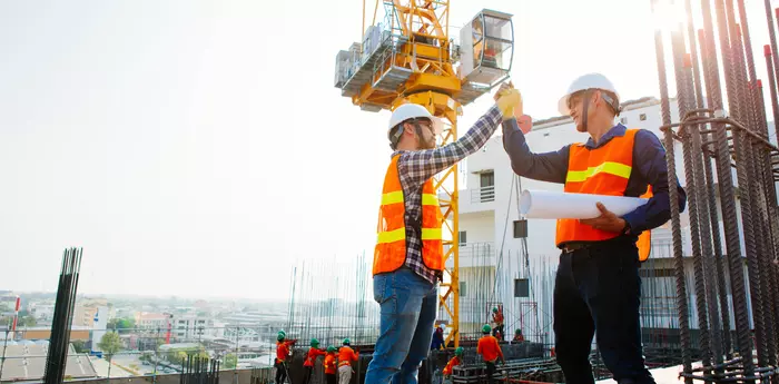 Engineers oversaw the construction site skyscraper
