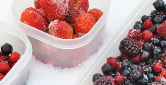 Frozen berries in plastic containers
