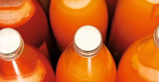 Bottles with orange juice