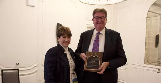 Chris Parr received an award at the UNITECR in Chicago