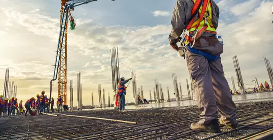 Construction worker control pouring concrete pump